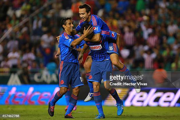 Nestor Vidrio of Chivas celebrate with teammates after scoring the first goal of his team during a match between Leon and Chivas as part of 13th...