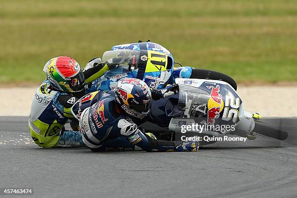 Brad Binder of South Africa and the Ambrogio Racing Mahindra and Danny Kent of Great Britain and the Red Bull Husqvarna AJO Husqvarna crash during...