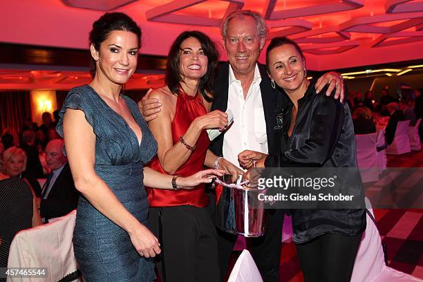 Mariella Ahrens, Gerit Kling, Prof. Dr. Werner Mang and his wife Sybille attend the Monti Memorial Charity Gala at Hotel Vier Jahreszeiten on October...