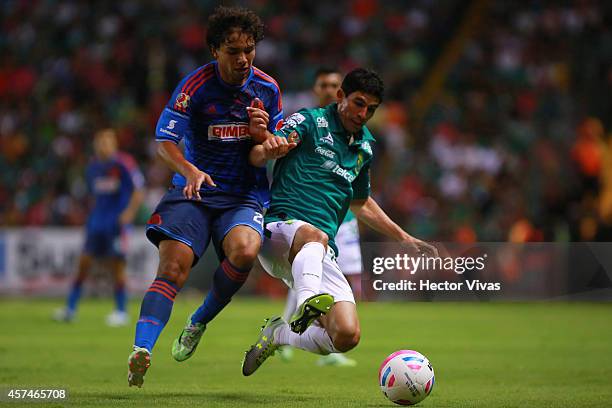 Jonny Magallon of Leon struggles for the ball with Giovani Hernandez of Chivas during a match between Leon and Chivas as part of 13th round Apertura...