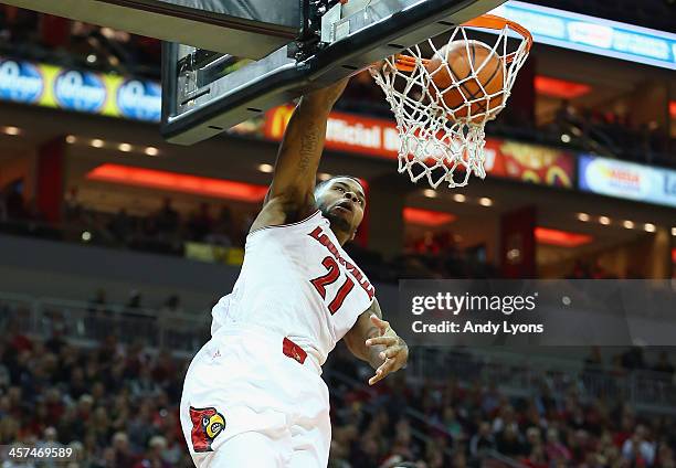 Chane Behanan of the Louisville Cardinals dunks the ball during the game against the Missouri State Bears at KFC YUM! Center on December 17, 2013 in...