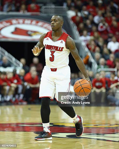 Chris Jones of the Louisville Cardinals dribbles the ball during the game against the Missouri State Bears at KFC YUM! Center on December 17, 2013 in...