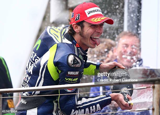 Valentino Rossi of Italy and rider of the Movistar Yamaha MotoGp Yamaha celebrates on the podium after winning the 2014 MotoGP of Australia at...