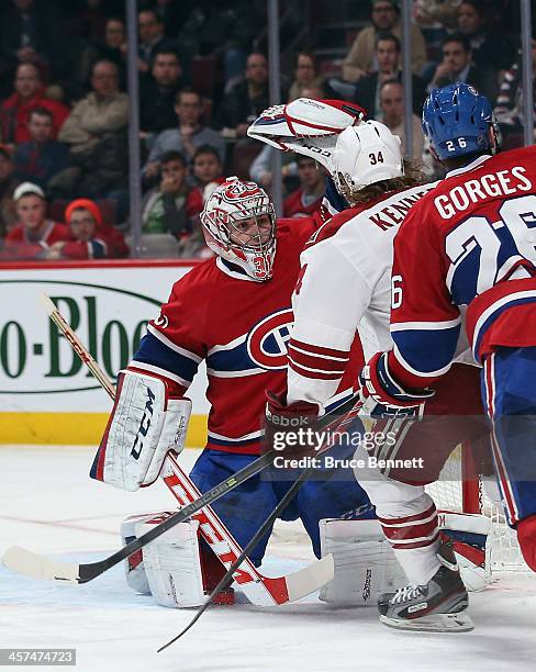 Carey Price of the Montreal Canadiens makes the third period save as Tim Kennedy of the Phoenix Coyotes looks for the rebound at the Bell Centre on...