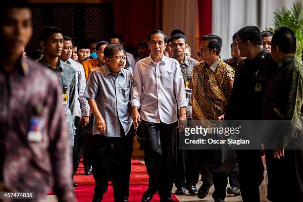 Indonesian President-elect Joko Widodo talk with Vice President-elect Jusuf Kalla after inauguration rehearsal on October 19, 2014 in Jakarta,...