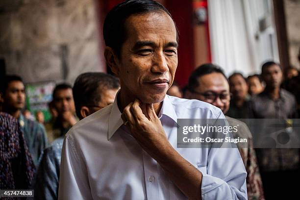 Indonesian President-elect Joko Widodo smiles after inauguration rehearsal on October 19, 2014 in Jakarta, Indonesia. Joko Widodo will be inaugurated...