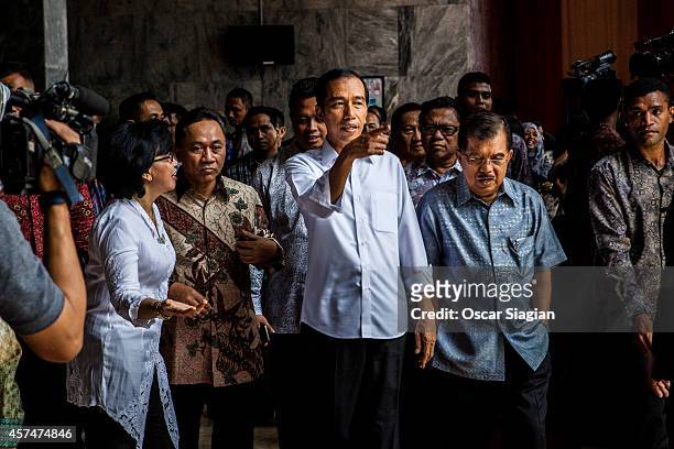 Indonesian President-elect Joko Widodo walk with Vice President-elect Jusuf Kalla after inauguration rehearsal on October 19, 2014 in Jakarta,...