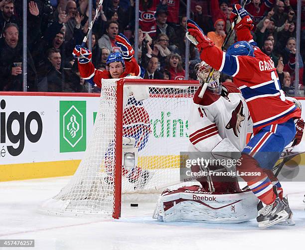 David Desharnais and Brendan Gallagher of the Montreal Canadiens, celebrate a goal by Andrei Markov on goaltender Mike Smith of the Phoenix Coyotes...