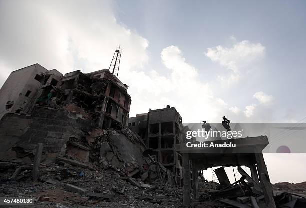 Palestinian boys practice parkour skills amid the ruins of buildings, which were destroyed by Israeli offensives in Beit Lahia town of Gaza on...