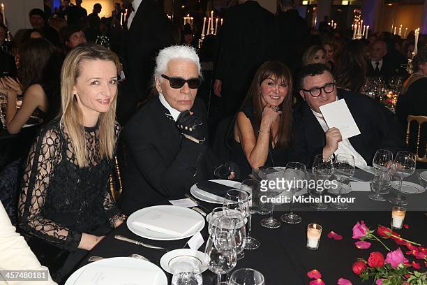 Delphine Arnault, Karl Lagerfeld, Babeth Djian and Albert Elbaz attend the Annual Charity Dinner Hosted By The AEM Association Children Of The World...