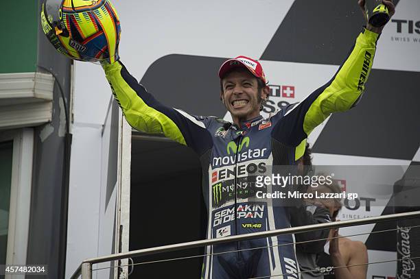 Valentino Rossi of Italy and Movistar Yamaha MotoGP celebrates on the podium the victory at the end of the MotoGP race during the 2014 MotoGP of...