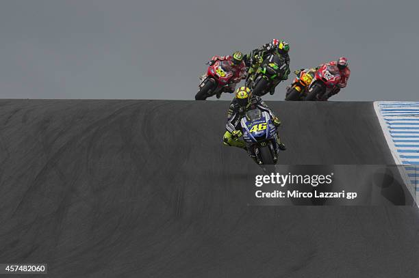 Valentino Rossi of Italy and Movistar Yamaha MotoGP leads the field during the MotoGP race during the 2014 MotoGP of Australia at Phillip Island...