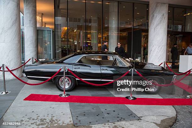 Fans admiring the prop car from the show while on display at the "Supernatural'" 200th episode celebration at the Fairmont Pacific Rim Hotel on...