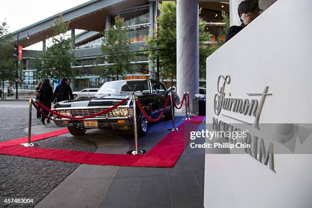 Fans admiring the prop car from the show while on display at the "Supernatural'" 200th episode celebration at the Fairmont Pacific Rim Hotel on...