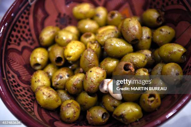 Olives are displayed at the SIAL , on October 19, 2014 in Villepinte, north-east of Paris. AFP PHOTO MARTIN BUREAU