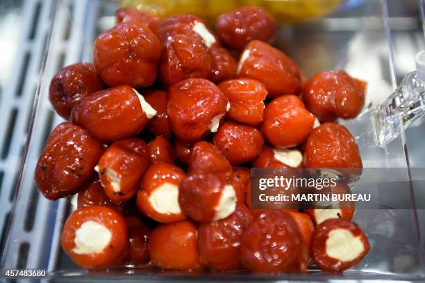 Appetizers of peppers stuffed with goat cheese are displayed at the SIAL , on October 19, 2014 in Villepinte, north-east of Paris. AFP PHOTO MARTIN...