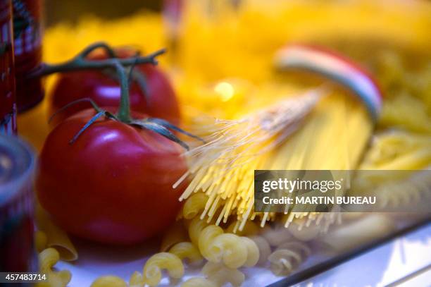 Pasta and tomatoes are displayed at the SIAL , on October 19, 2014 in Villepinte, north-east of Paris. AFP PHOTO MARTIN BUREAU