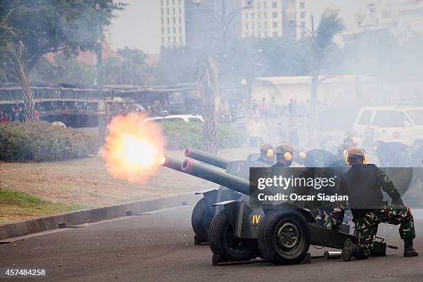 The Indonesian army rehearse around the National Monument as they prepare for the inaguration of Indonesia President Joko Widodo on October 19, 2014...