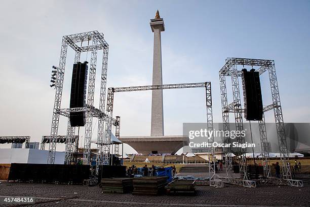 People build the stage as they prepre for the inaguration Indonesian President Joko Widodo at the National Monument on October 19, 2014 in Jakarta,...