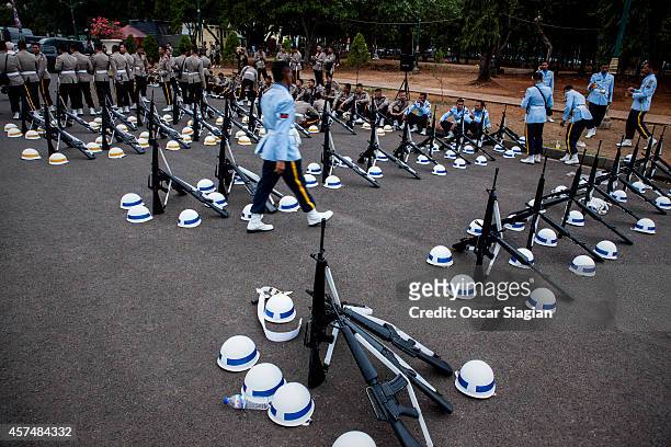 Security guards lay out their equipment by the National Monument as they prepare for the inaguration of Indonesia President Joko Widodo on October...