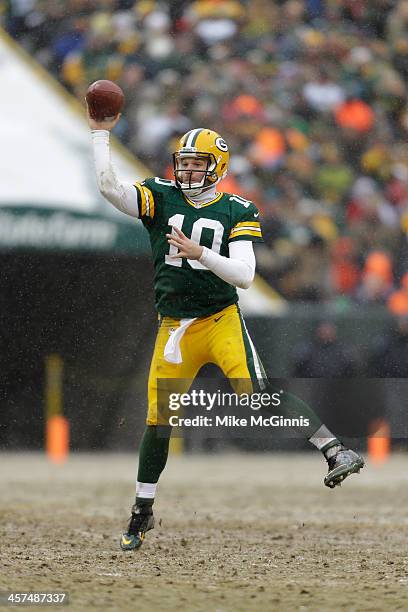 Matt Flynn of the Green Bay Packers scrambles out of the pocket and passes the football during the game against the Atlanta Falcons at Lambeau Field...