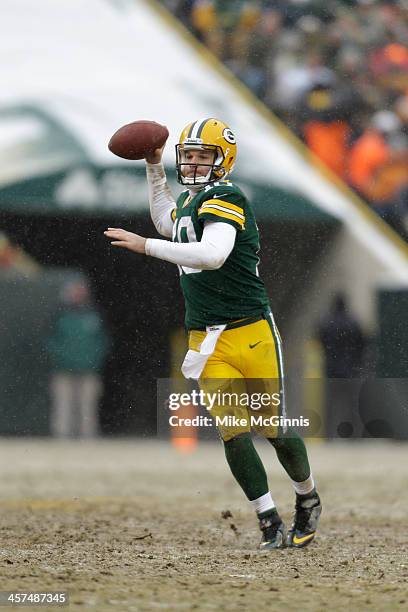 Matt Flynn of the Green Bay Packers scrambles out of the pocket and passes the football during the game against the Atlanta Falcons at Lambeau Field...