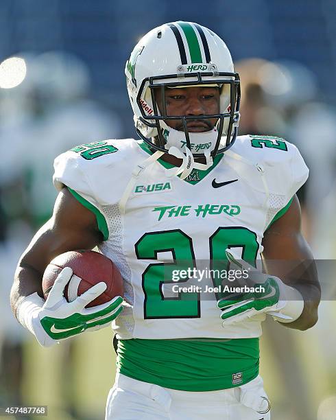 Steward Butler of the Marshall Thundering Herd runs with the ball prior to the game against the Florida International Panthers on October 18, 2014 at...