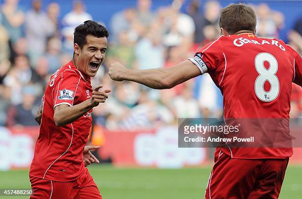Philppe Coutinho of Livepool scores their second goal during the Barclays Premier League match between Queens Park Rangers and Liverpool at Loftus...