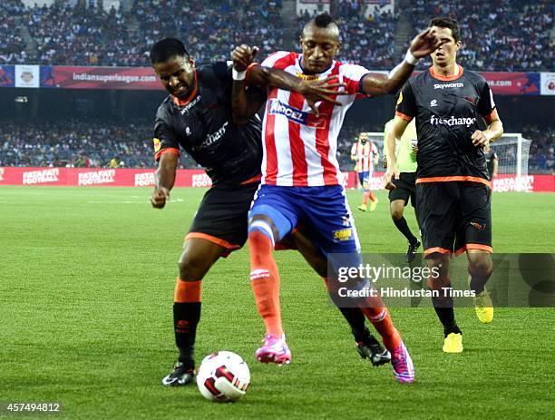 Atletico de Kolkata footballer Fikru Lemessa vying for ball with Delhi Dynamos FC player during the Indian Super League football match between...