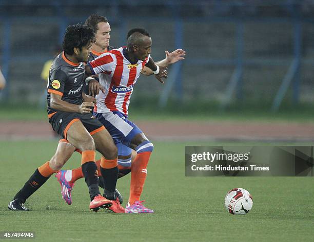 Atletico De Kolkata player in action defending Delhi Dynamos FC player during ISL match at The Salt Lake Stadium Kolkata, India on Sunday October 19,...