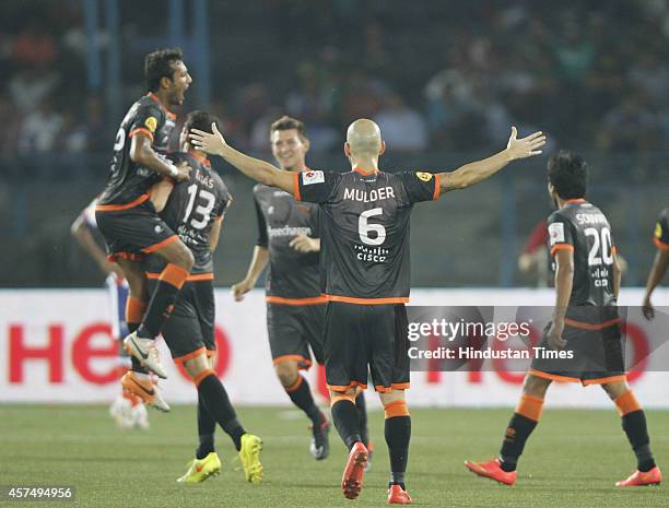 Delhi Dynamos FC players celebrate after scoring a goal during the Indian Super League football match between Atletico de Kolkata and Delhi Dynamos...