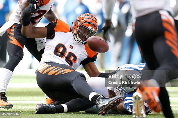 Carlos Dunlap of the Cincinnati Bengals strips the football from Ahmad Bradshaw of the Indianapolis Colts during the first quarter on October 19,...