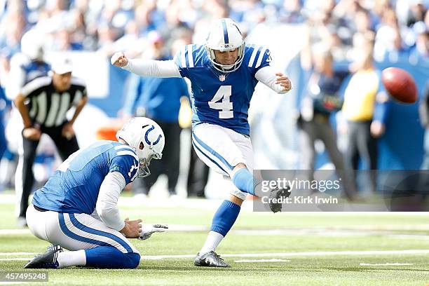 Adam Vinatieri of the Indianapolis Colts kicks a field goal to put the first points on the score board during the first quarter against the...