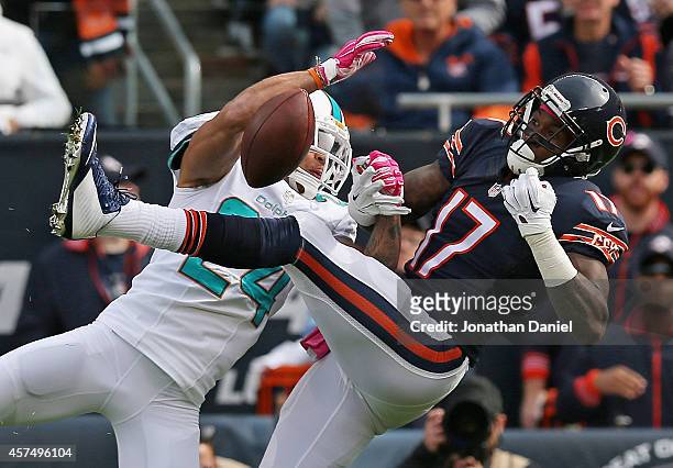Cortland Finnegan of the Miami Dolphins breaks up a pass intended for Alshon Jeffery of the Chicago Bears at Soldier Field on October 19, 2014 in...