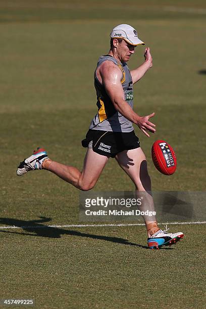 Nathan Foley kicks the ball during a Richmond Tigers AFL training session at ME Bank Centre on December 18, 2013 in Melbourne, Australia.