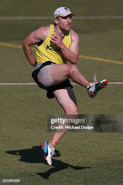 Nathan Foley kicks the ball during a Richmond Tigers AFL training session at ME Bank Centre on December 18, 2013 in Melbourne, Australia.