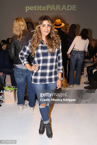 Larsa Pippen poses before the Ruum preview at petitePARADE / Kids Fashion Week at Bathhouse Studios on October 19, 2014 in New York City.