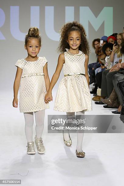Harper Tillman and Sophia Pippen walk the runway during the Ruum preview at petitePARADE / Kids Fashion Week at Bathhouse Studios on October 19, 2014...