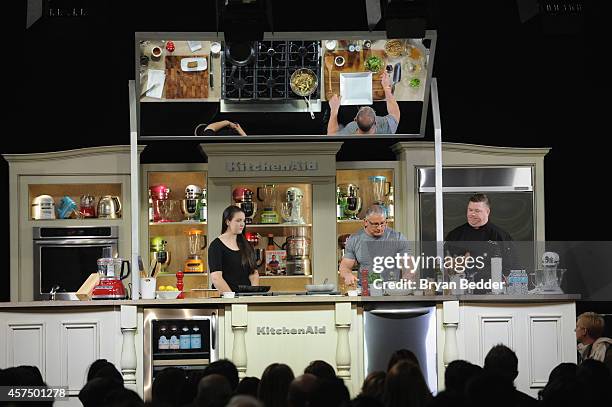 Chef Robert Irvine conducts a culinary presentation with his daughter Annalise Irvine at KitchenAid stage at the Grand Tasting presented by ShopRite...