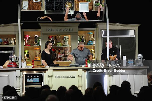 Chef Robert Irvine conducts a culinary presentation with his daughter Annalise Irvine at KitchenAid stage at the Grand Tasting presented by ShopRite...