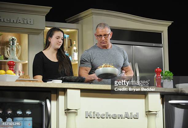 Chef Robert Irvine conducts a culinary presentation with his daughter Annalise Irvine at KitchenAid stage at the Grand Tasting presented by ShopRite...