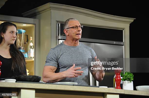 Chef Robert Irvine conducts a culinary presentation with his daughter Annalise Irvine at KitchenAid stage at the Grand Tasting presented by ShopRite...