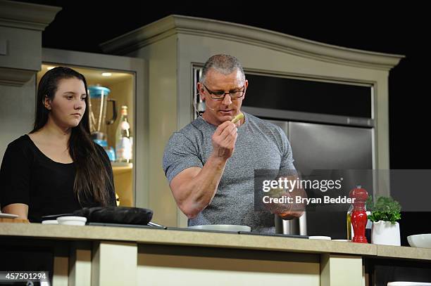 Chef Robert Irvine conducts a culinary presentation with his daughter Annalise Irvine at KitchenAid stage at the Grand Tasting presented by ShopRite...