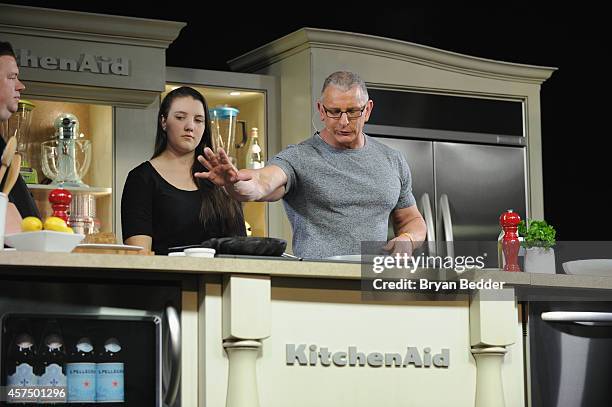 Chef Robert Irvine conducts a culinary presentation with his daughter Annalise Irvine at KitchenAid stage at the Grand Tasting presented by ShopRite...