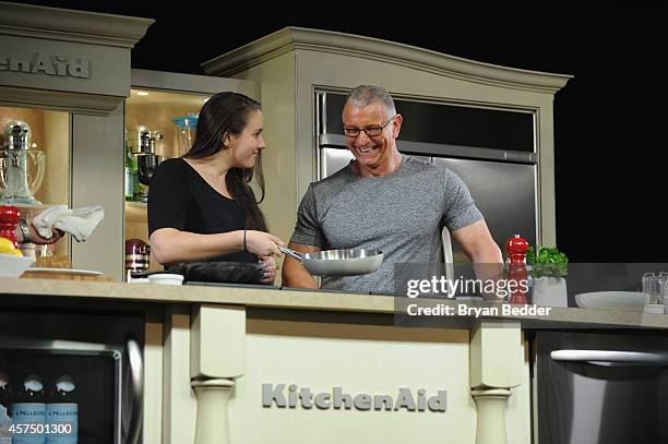 Chef Robert Irvine conducts a culinary presentation with his daughter Annalise Irvine at KitchenAid stage at the Grand Tasting presented by ShopRite...