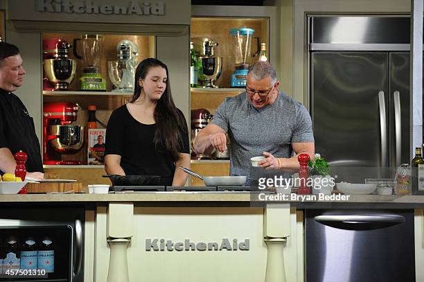 Chef Robert Irvine conducts a culinary presentation with his daughter Annalise Irvine at KitchenAid stage at the Grand Tasting presented by ShopRite...