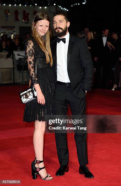 Mia Goth and Shia LaBeouf attend the closing night Gala screening of "Fury" during the 58th BFI London Film Festival at Odeon Leicester Square on...