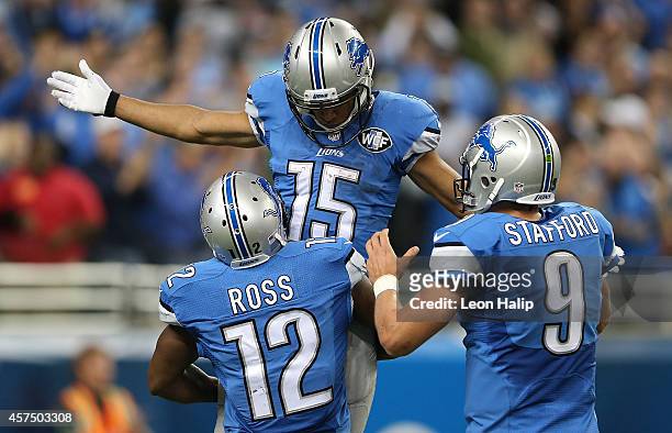 Golden Tate, Jeremy Ross and Matthew Stafford of the Detroit Lions celebrate a fourth quarter touchdown against the New Orleans Saints at Ford Field...