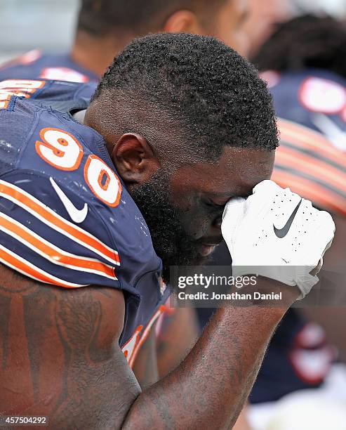 Jeremiah Ratliff of the Chicago Bears sits on the bench near the end of a game against the Miami Dolphins at Soldier Field on October 19, 2014 in...