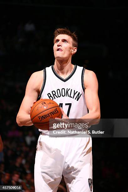 Andrei Kirilenko of the Brooklyn Nets shoots a free throw against the Boston Celtics during the game on October 19, 2014 at Barclays Center in...